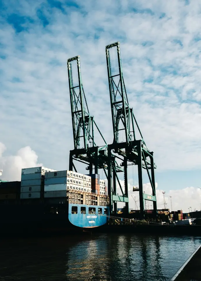 black metal crane under cloudy sky during daytime